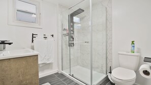 Shower, towels, soap, toilet paper