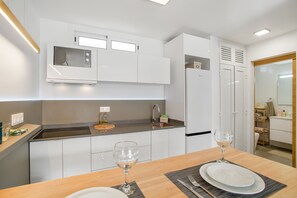 Fridge, microwave, stovetop, coffee/tea maker