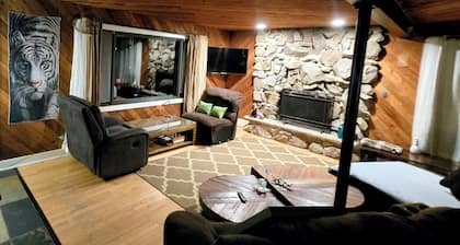 3-bedroom hillside property in woods with fireplace and lake view