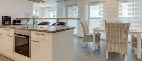 Oven, stovetop, dining tables