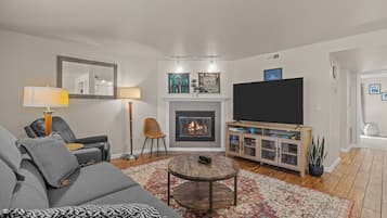 Smart TV, fireplace, table football, books
