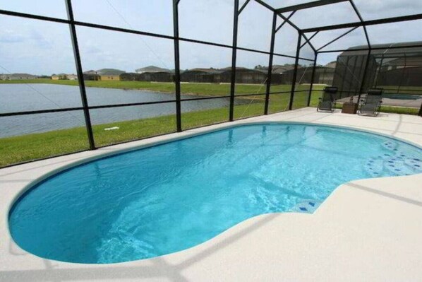 Enjoy a serene swim with a clear view of the surrounding landscape from this pool.
