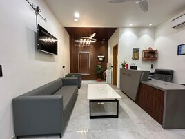 Habitación Deluxe doble | Zona de estar | Una impresora