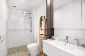Shower, hair dryer, towels, shampoo