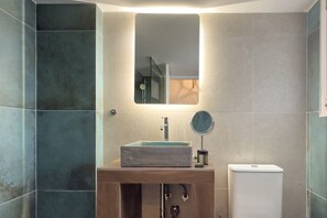 A bathroom with a rectangular sink, a mirror, and a toilet. - Phaedrus Living: Kallithea Heights Residence (Kallithea)