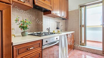 Fridge, coffee/tea maker, cookware/dishes/utensils