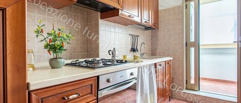Fridge, coffee/tea maker, cookware/dishes/utensils