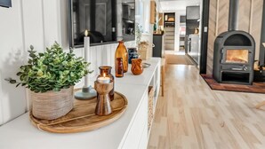 A modern kitchen with a central island, a built-in stove, and a large window. - "Fatima" - 1km from the sea by Interhome (Fanø)