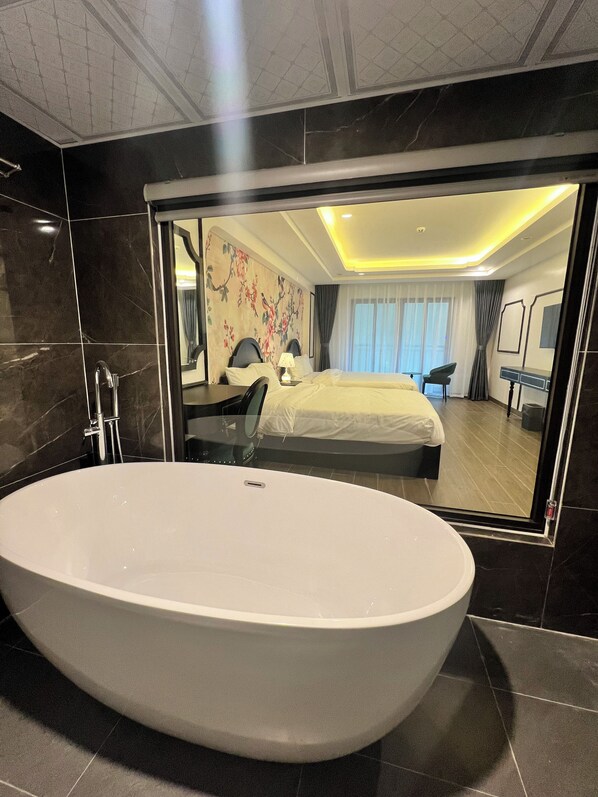 Premier Twin Room, Balcony, Garden View | Bathroom | Hair dryer, slippers, towels, soap