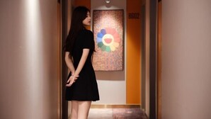 A hallway with a door labeled "8602" and a colorful abstract painting on the wall. - CEO· Lan Hotel (Yiwu)