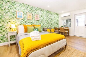 1 bedroom, desk, iron/ironing board, travel crib