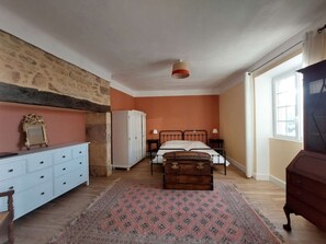 A bedroom with a bed, a dresser, a wardrobe, a nightstand, and a window. - Charming 6-bedroom house in Dordogne for a peaceful getaway (Sainte-Mondane)