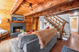 50-inch Smart TV with digital channels, fireplace, books