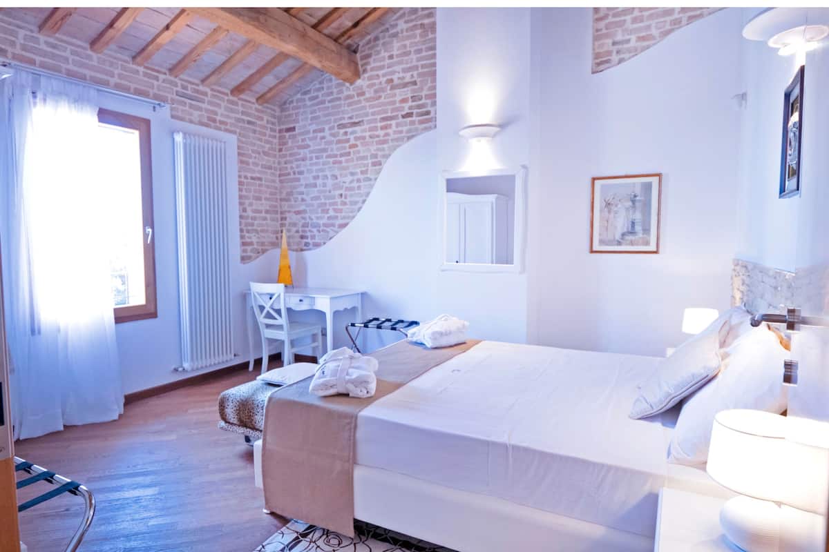 Luxury Apartment, Pool View | Minibar, in-room safe, blackout drapes, soundproofing