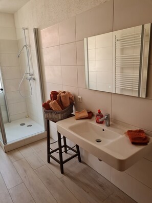 Shower, hair dryer, towels, soap