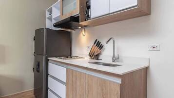 Fridge, microwave, stovetop, coffee/tea maker