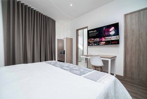 Enjoy a comfortable stay in this well-appointed room with a made bed, desk, and TV featuring a selection of movies and TV shows.