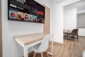 Enjoy a comfortable stay with a flat-screen TV, desk, and dining area.