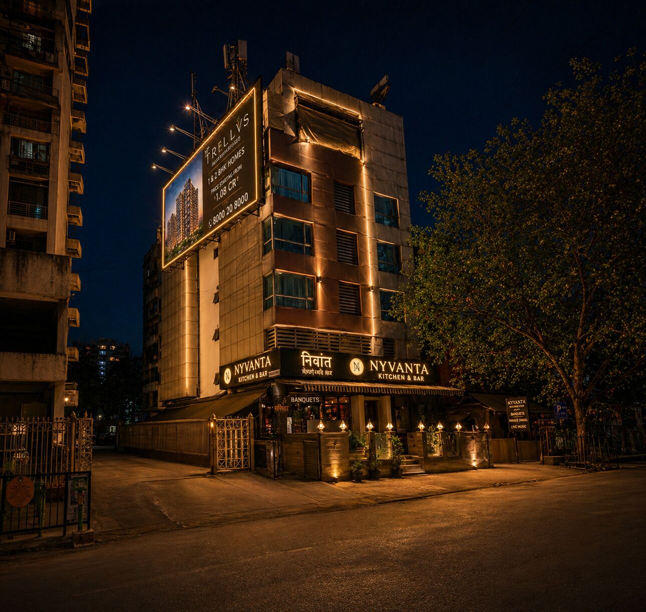 A multi-story building with a prominent sign for 'NYVANTA KITCHEN & BAR' at the ground level.