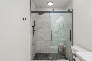 Shower, hair dryer, towels, soap