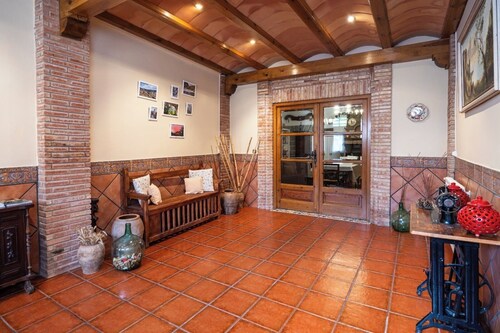 Village house with picnic area and fireplace.