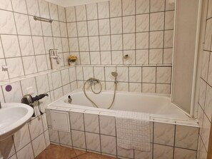 Hair dryer, towels, soap, toilet paper