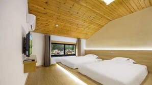 A modern hotel room with a wooden ceiling, two beds, a TV, and a window with a view of houses. - Anji Qile Farm (Anji)