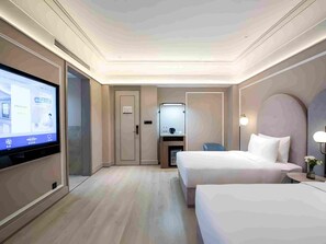 A hotel room with a TV, two beds, a desk, and a mirror. - Mercure Qingdao Zhanqiao (Qingdao)