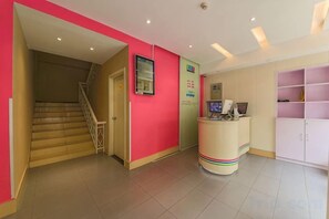 A reception area with a staircase, a reception desk, and a counter. - 100 Inn (Shanghai Changhai Hospital & Xiangyin Road Metro Station) (Shanghai)