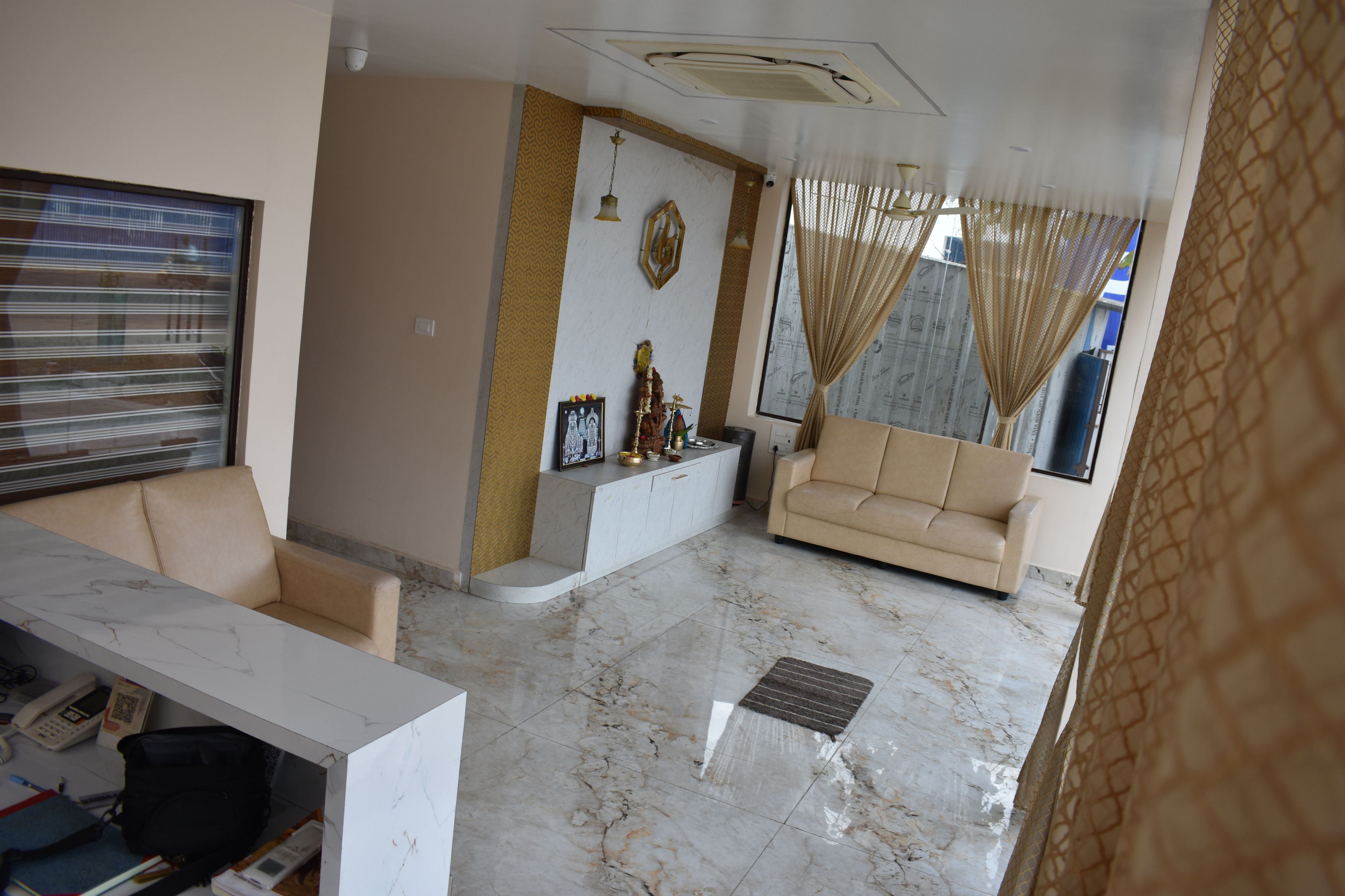A living room with a sofa, a coffee table, and a TV.