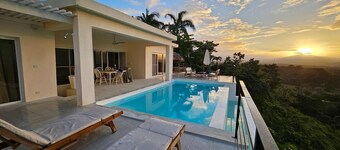 Villa elevated on a hill overlooking a majestic view of the sea