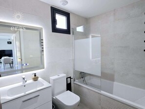 Shower, hair dryer, towels, toilet paper