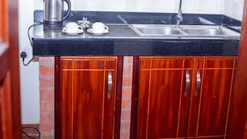 Double Room Single Use, Balcony, Valley View | Private kitchen | Cleaning supplies