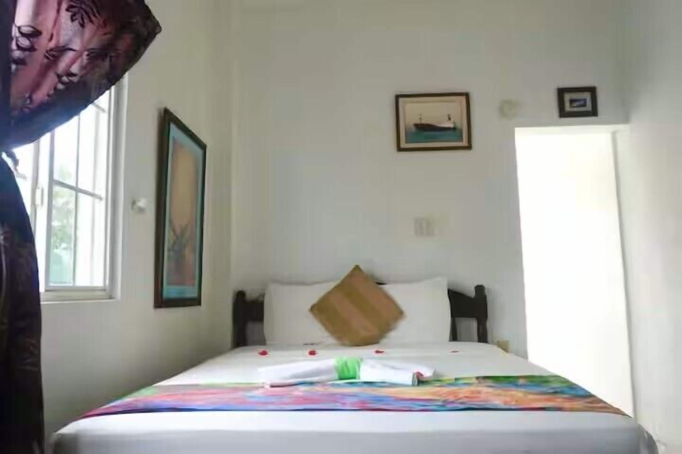 Economy Studio, 1 Queen Bed, Refrigerator & Microwave, Poolside | Individually decorated, individually furnished, iron/ironing board