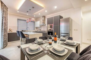 Enjoy meals and socializing in the spacious dining area with a central island.
