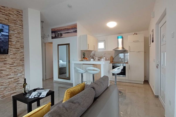 Apartment (Beachfront Apartment with Balcony and) | Living room | 32-inch flat-screen TV with satellite channels