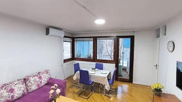 Comfort Apartment, Non Smoking | Living area | 90-inch flat-screen TV with cable channels
