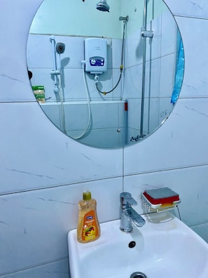 Shower, towels, soap, toilet paper