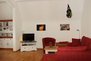 Télévision, lecteur de DVD, livres