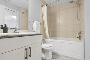 Shower, jetted tub, hair dryer, towels