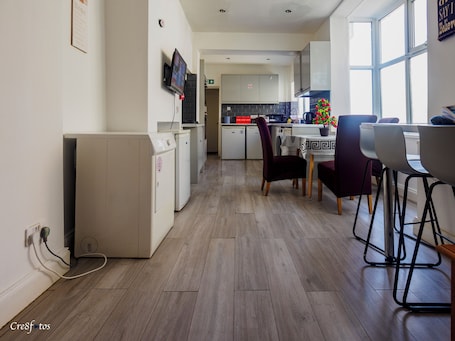 Full-size fridge, microwave, cookware/dishes/utensils