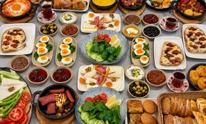 A variety of dishes and food items arranged on a table. - PALM BEACH HOTEL (Silifke)