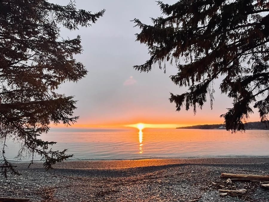 On the beach, black sand