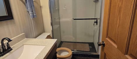 Shower, hair dryer, towels, soap