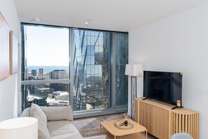 TV - West Side Place 2BR | Pool, Sauna & Luxe Living (Melbourne)