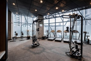 Stay fit and active in this well-equipped gym with treadmills, ellipticals, and weightlifting stations.