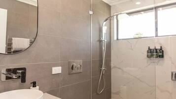 Shower, hair dryer, towels, soap