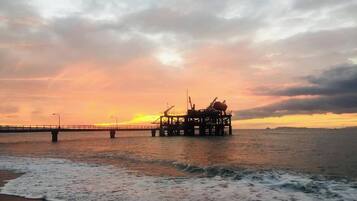 A pier extending into the water with a platform structure, likely for industrial or maritime purposes.