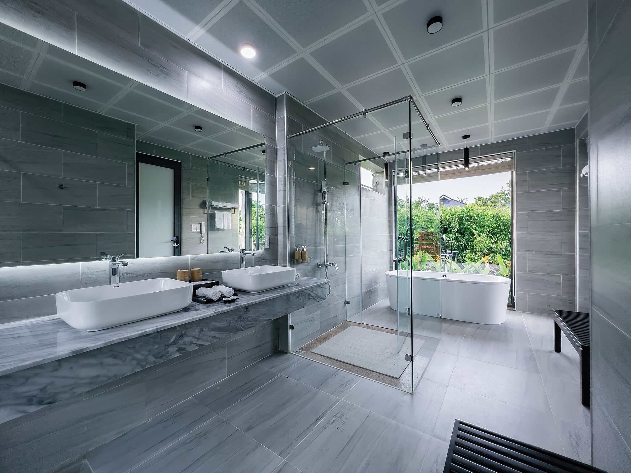 Separate tub and shower, hair dryer, bathrobes, slippers