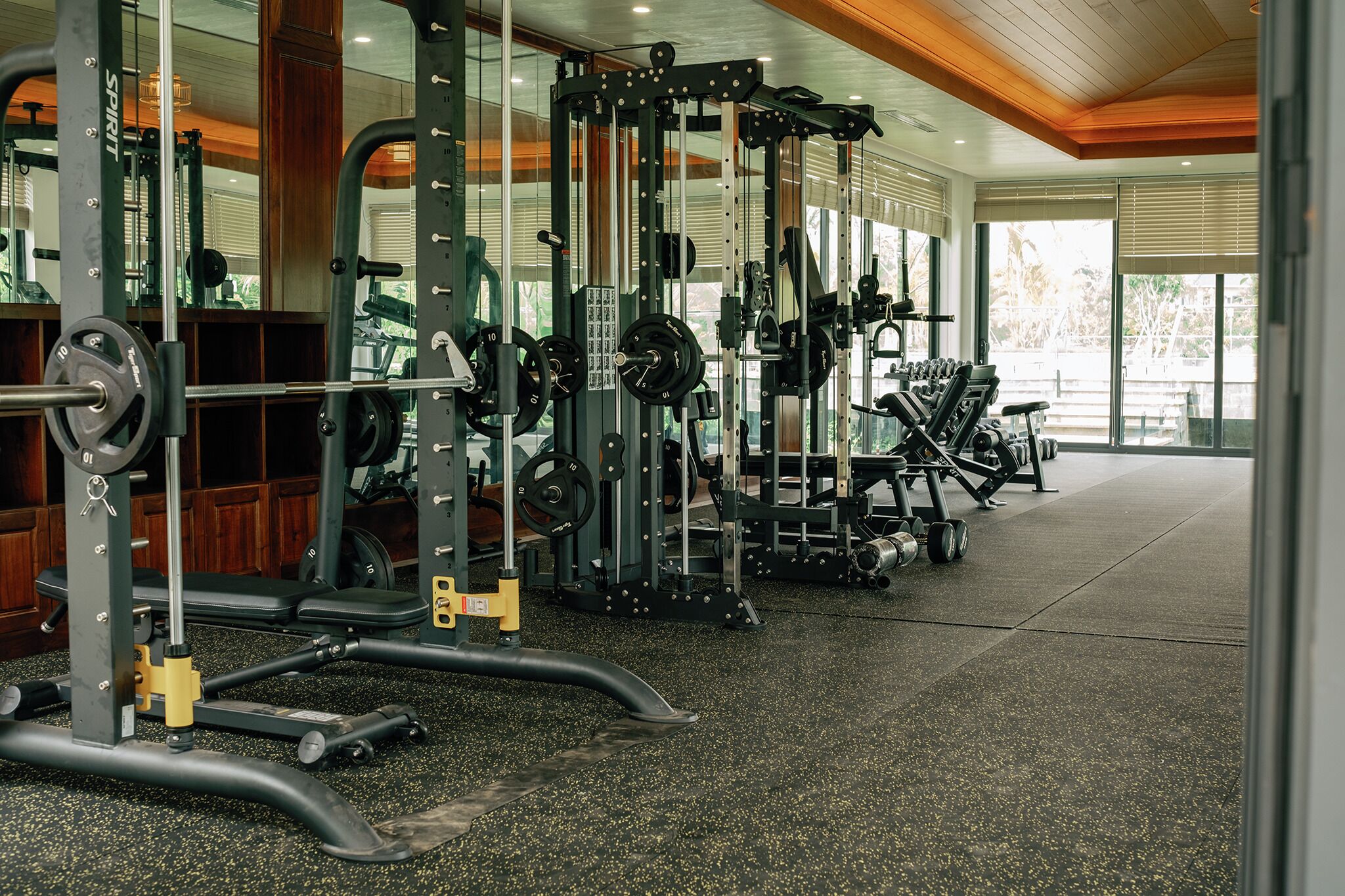 A gym with various exercise equipment, including weight machines and free weights.